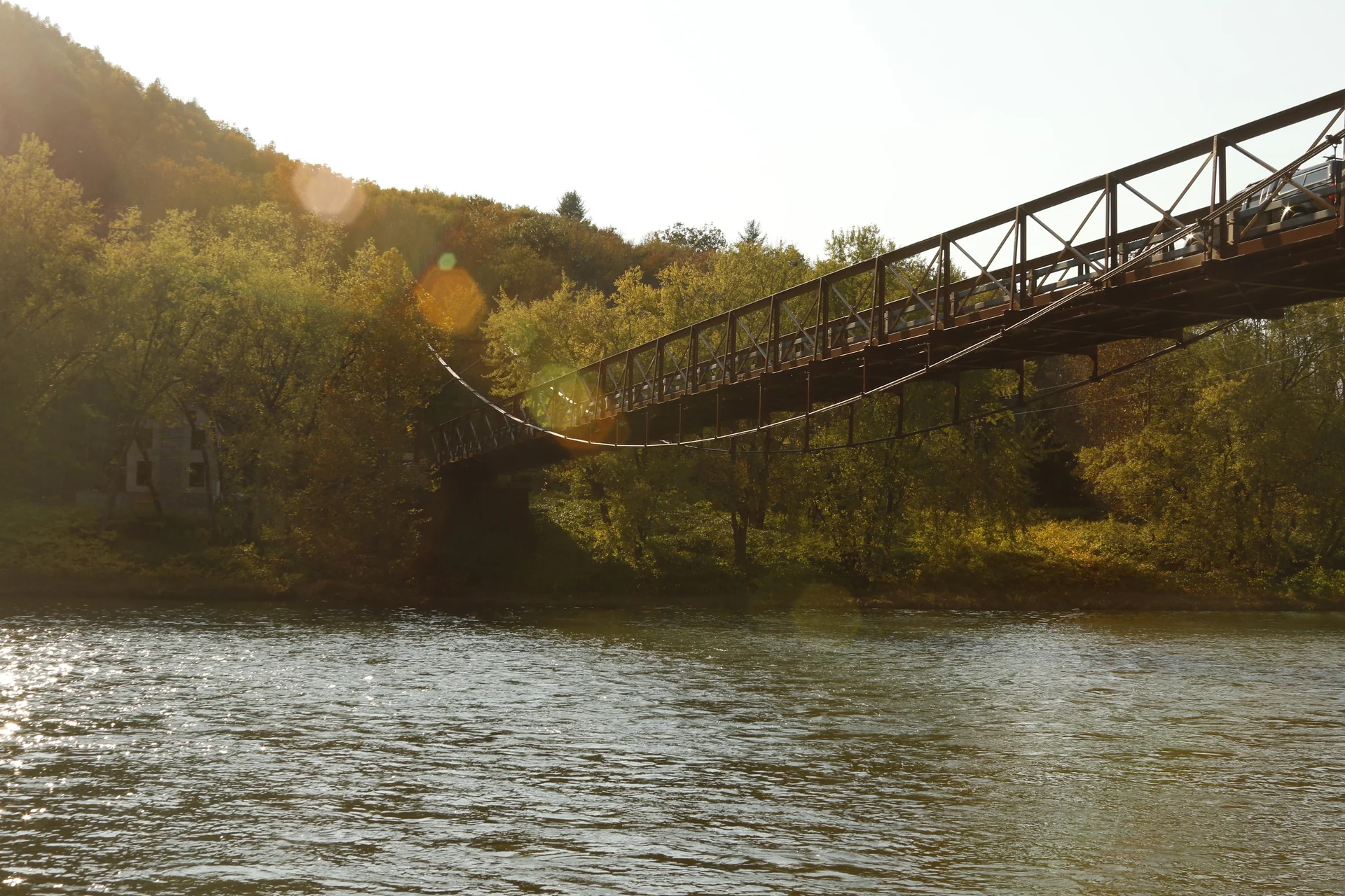 Warm afternoon light across a bridge over the river.